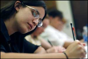 girl-student-writing-in-exam